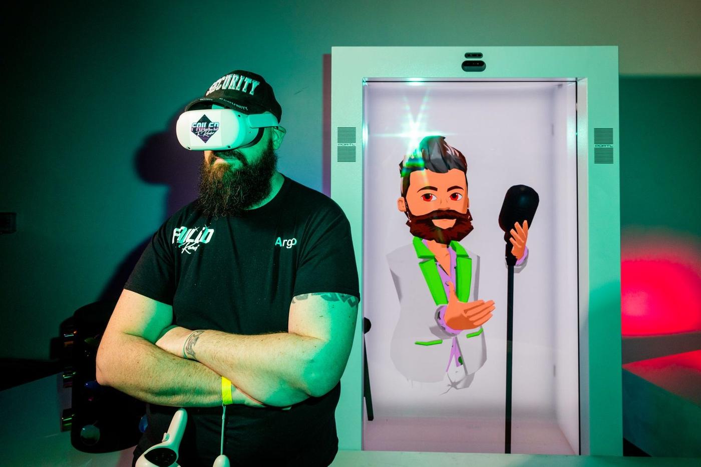 Kyle Render in a VR headset inside a hologram booth