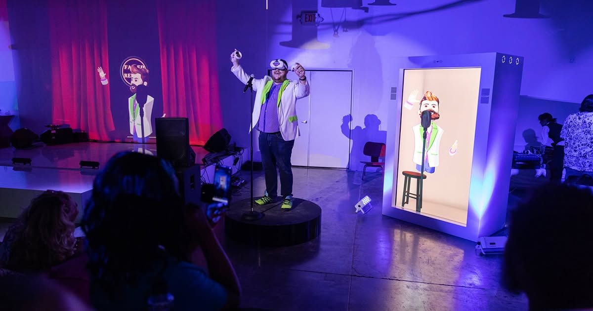 Big Al Gonzales on stage at the Las Vegas hybrid show with a VR comic in the Proto hologram box